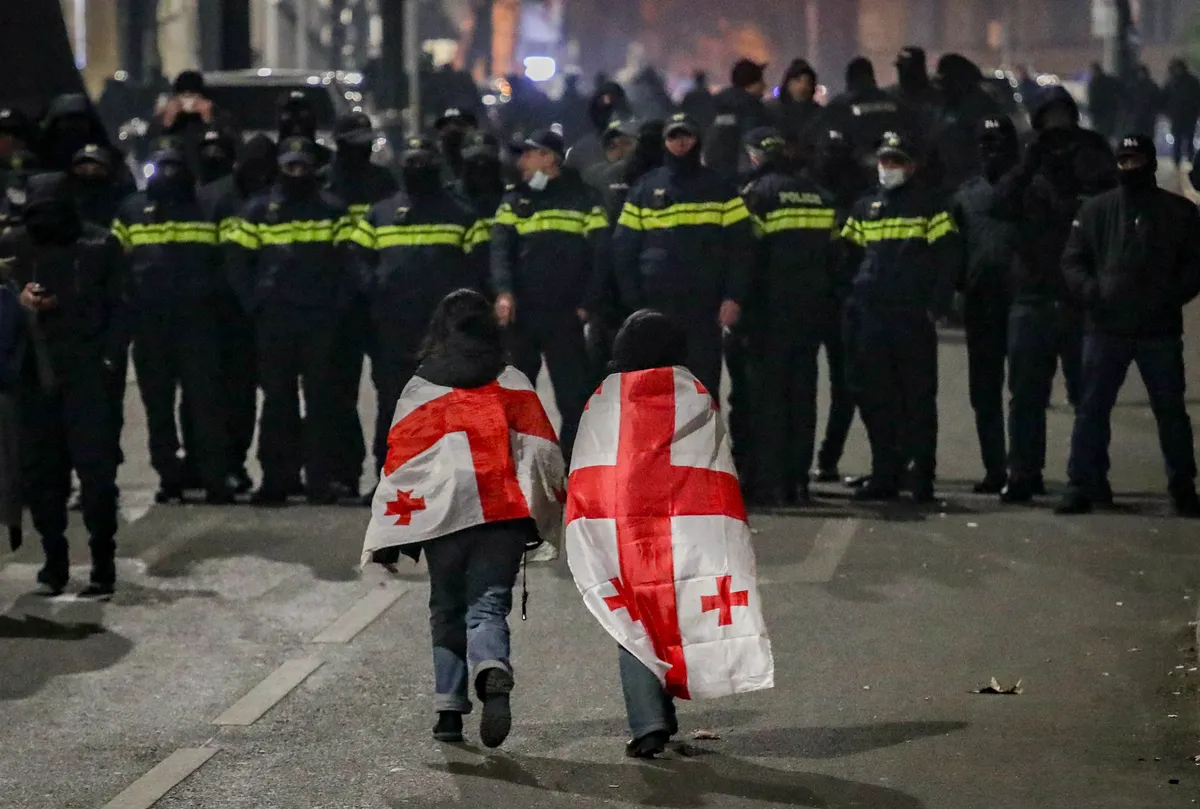 Supporters of the Georgian opposition face off riot police during a protest in front of the country's parliament in Tbilisi, 6 December 2024. Photo: EPA-EFE / DAVID MDZINARISHVILI