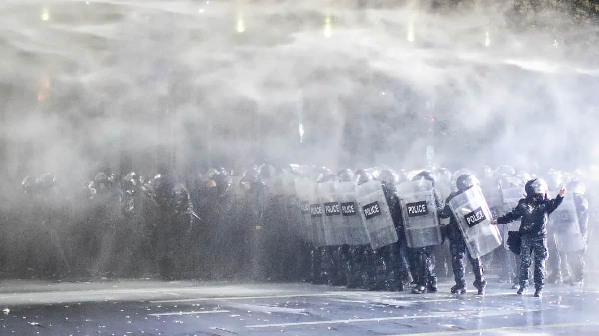 Police use water cannons and tear gas to disperse protesters in front of the parliament building in Tbilisi, Georgia, 29 November 2024. Photo: EPA / David Mdzinarishvili