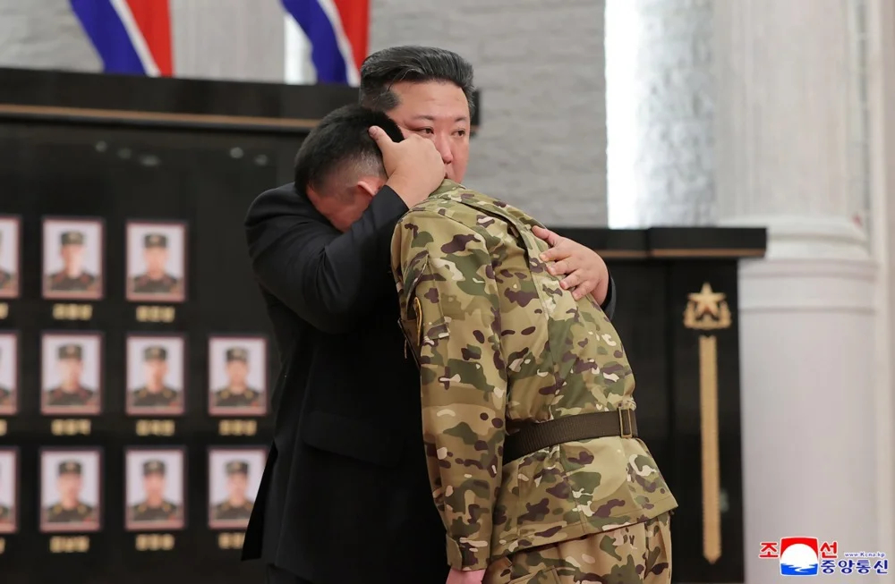 Kim Jong Un comforts a North Korean soldier in a ceremony honouring soldiers serving in overseas operations held in Pyongyang, North Korea. Photo: EPA/KCNA